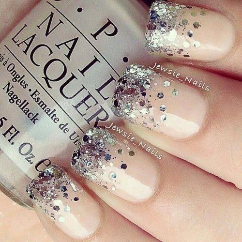 Glitter Nails. A nice glamorous look to go with that white dress with chrome steel jewelry.